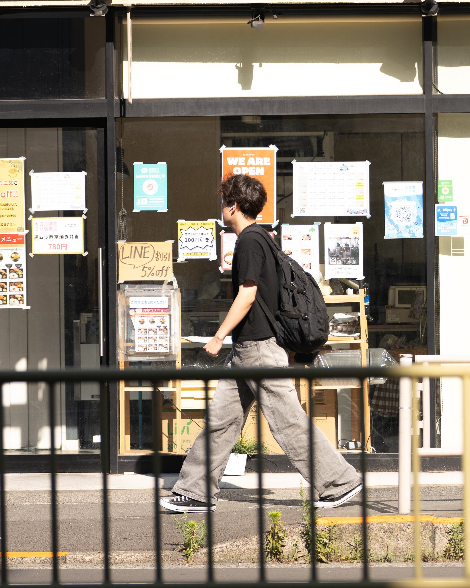 Candid street photograph, frame 7 of 14